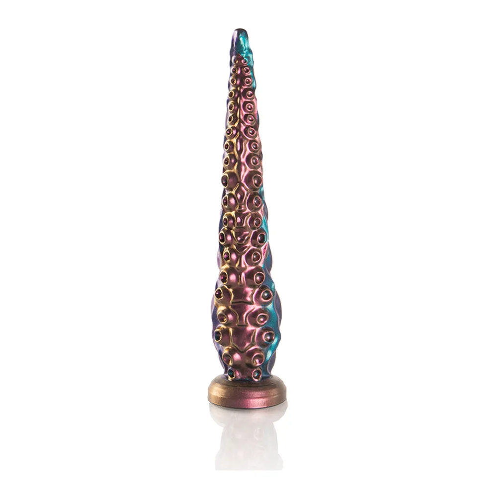 Gode tentacule effilé en silicone irisé bleu et rose, recouvert de ventouses en relief, base métallisée rose-doré, sur fond blanc