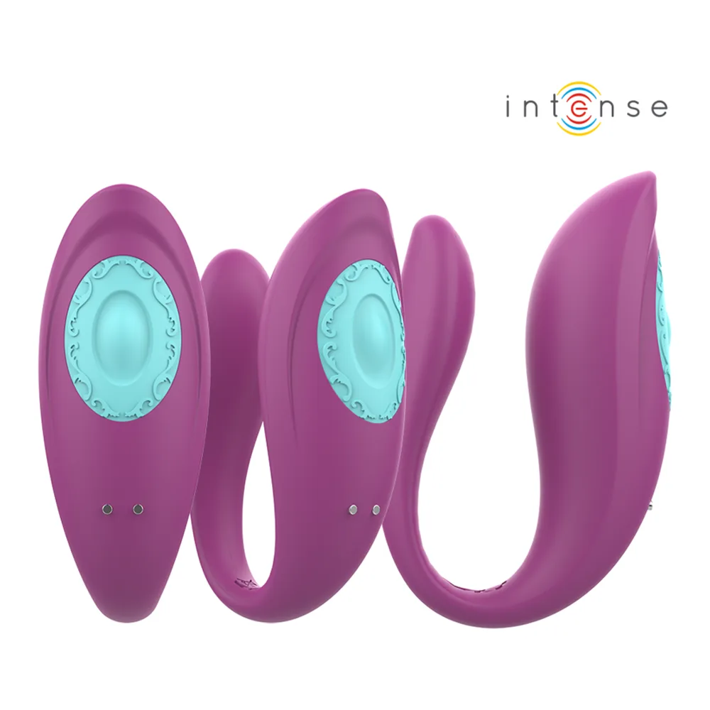 Vibromasseur en silicone rose mauve en forme de U avec zone de stimulation turquoise, accompagné de sa télécommande noire, sur fond blanc