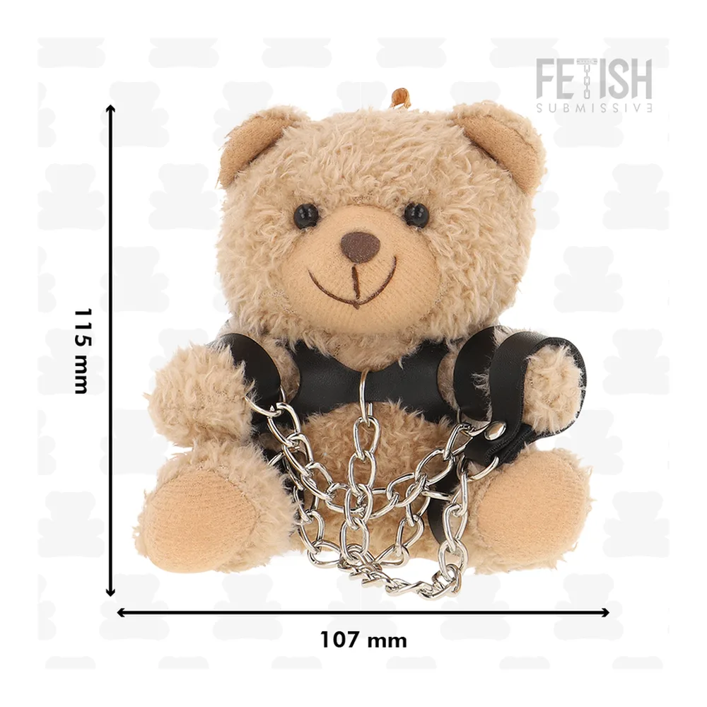 Peluche ours beige avec gilet noir en cuir, menottes à chaîne métallique, schéma de dimensions indiquant 151 mm de hauteur et 107 mm de largeur