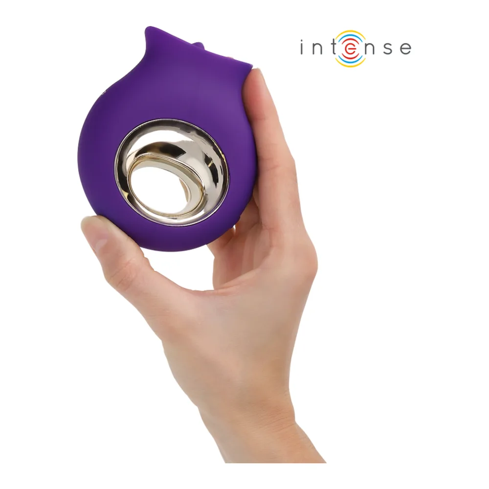 Stimulateur clitoridien Tuli violet en silicone avec coupelle vibrante et embout métallisé cuivre, détail en médaillon montrant l'intérieur de la coupelle aux 9 modes de stimulation