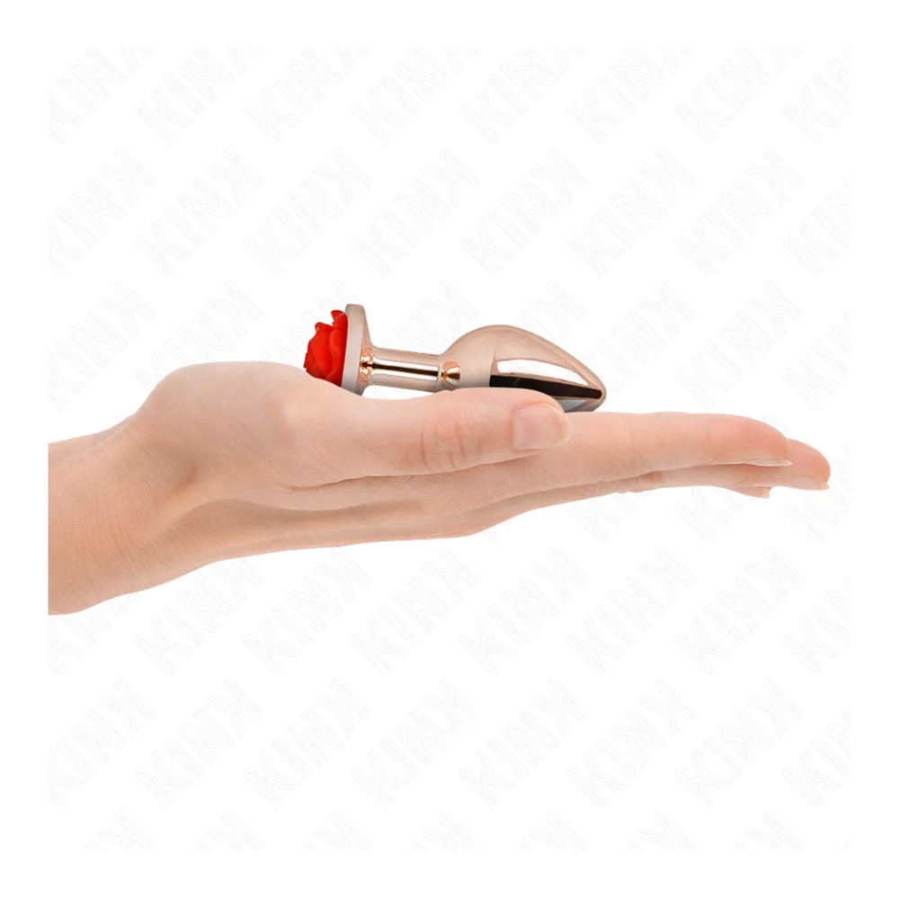 Plug anal taille S en acier inoxydable or rose poli, forme ovoïde avec base décorée d'une rose rouge, montré avec deux autres tailles en verre transparent sur fond blanc