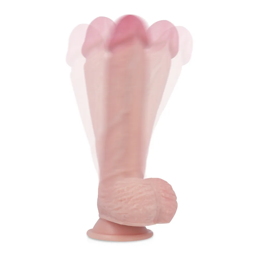 Gode réaliste en silicone rose avec base ventouse large, détails anatomiques marqués et tête arrondie, montré de profil sur fond blanc