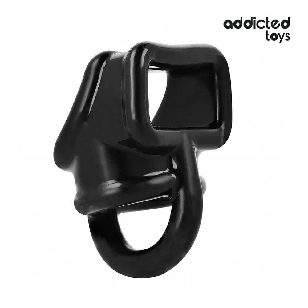 Cage à pénis Addicted Toys en silicone noir avec anneau de base et capuchon supérieur, présentée avec son emballage blanc et noir