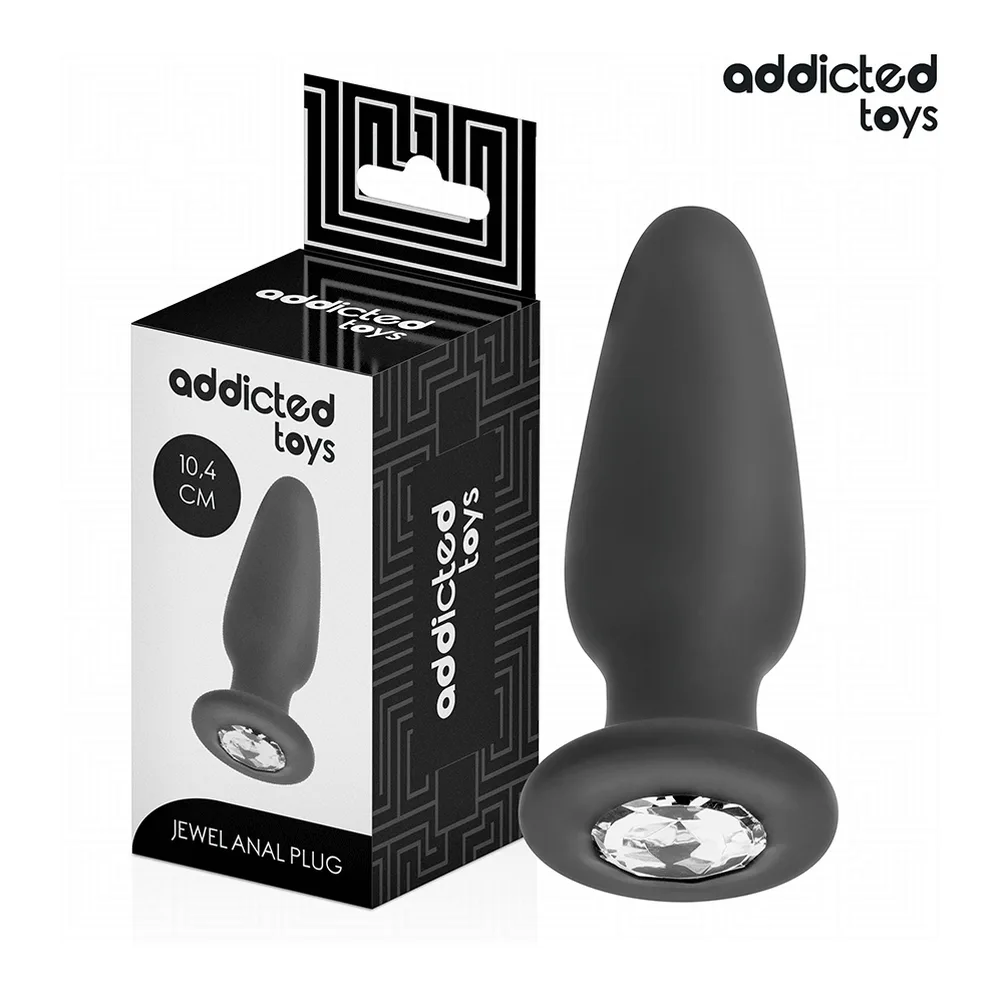 Plug anal noir en silicone avec base bijou argentée, tenu dans deux mains ouvertes sur fond blanc