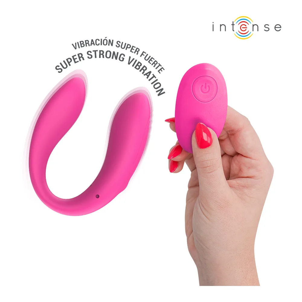 Stimulateur de couple en silicone rose fuchsia avec forme ergonomique en U, télécommande sans fil rose assortie, emballage blanc affichant les caractéristiques et pictogrammes d'utilisation