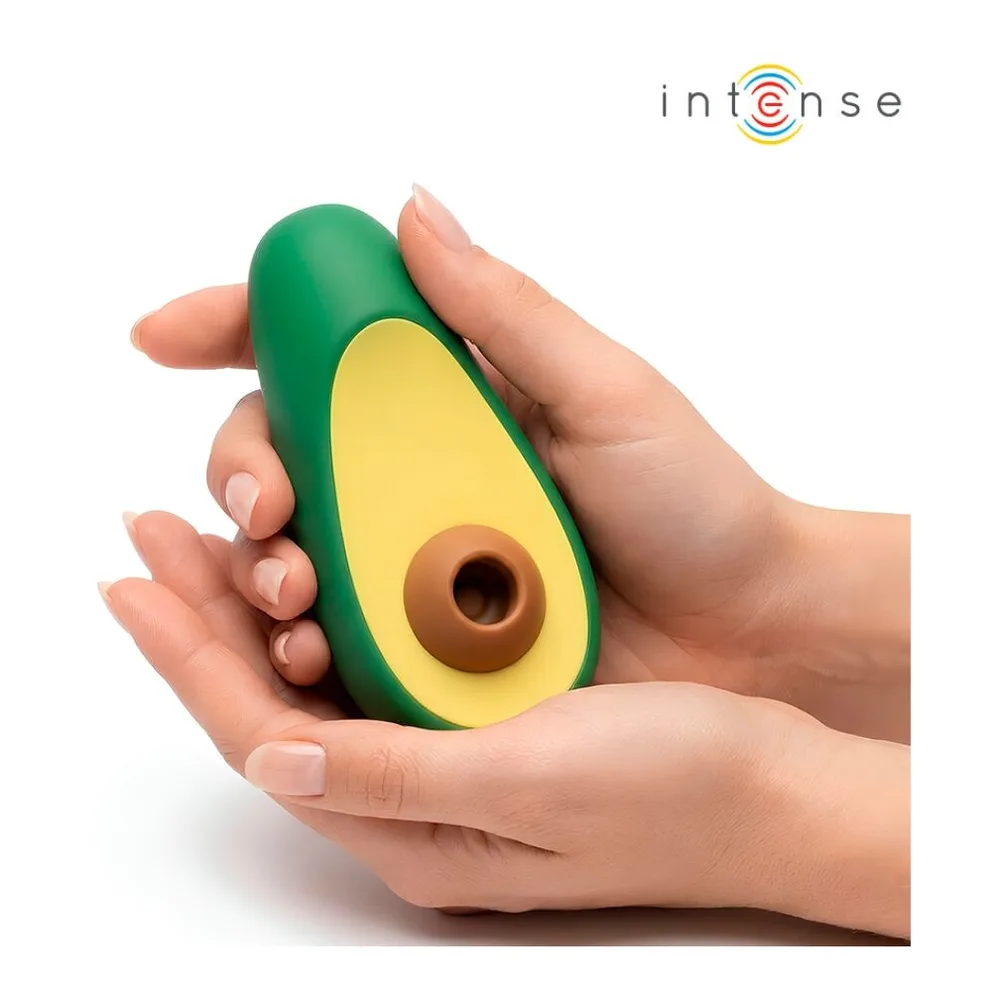 Stimulateur clitoridien en silicone vert et jaune, forme d'avocat avec noyau brun, sur fond blanc avec logo Intense et ondes de vibration bleues et vertes
