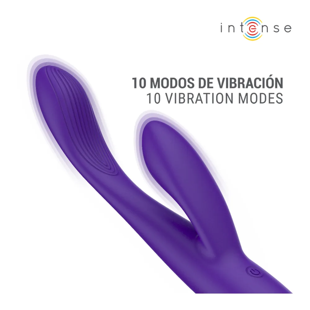 Stimulateur rabbit violet et jaune fluo tenu en main sur fond blanc, avec embout recourbé et branches auriculaires écartées