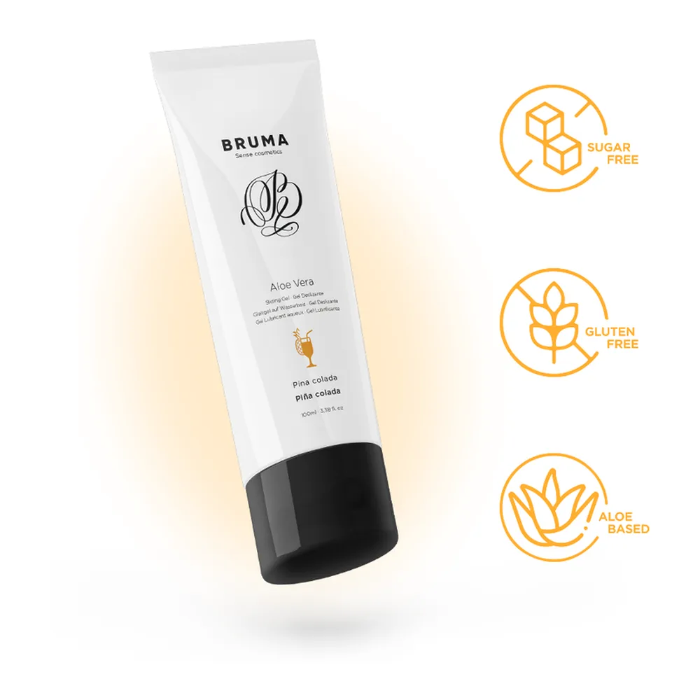 Tube blanc de gel lubrifiant Bruma à base d'aloe vera, saveur pina colada, avec capuchon noir, sur fond dégradé jaune pâle
