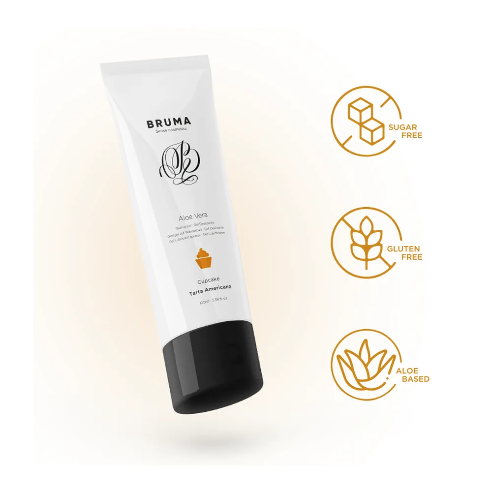 Tube blanc de gel lubrifiant Bruma à l'aloe vera, parfum cupcake, 100 ml, avec capuchon noir, présenté aux côtés de schémas montrant sa conformité pour bagage cabine avion
