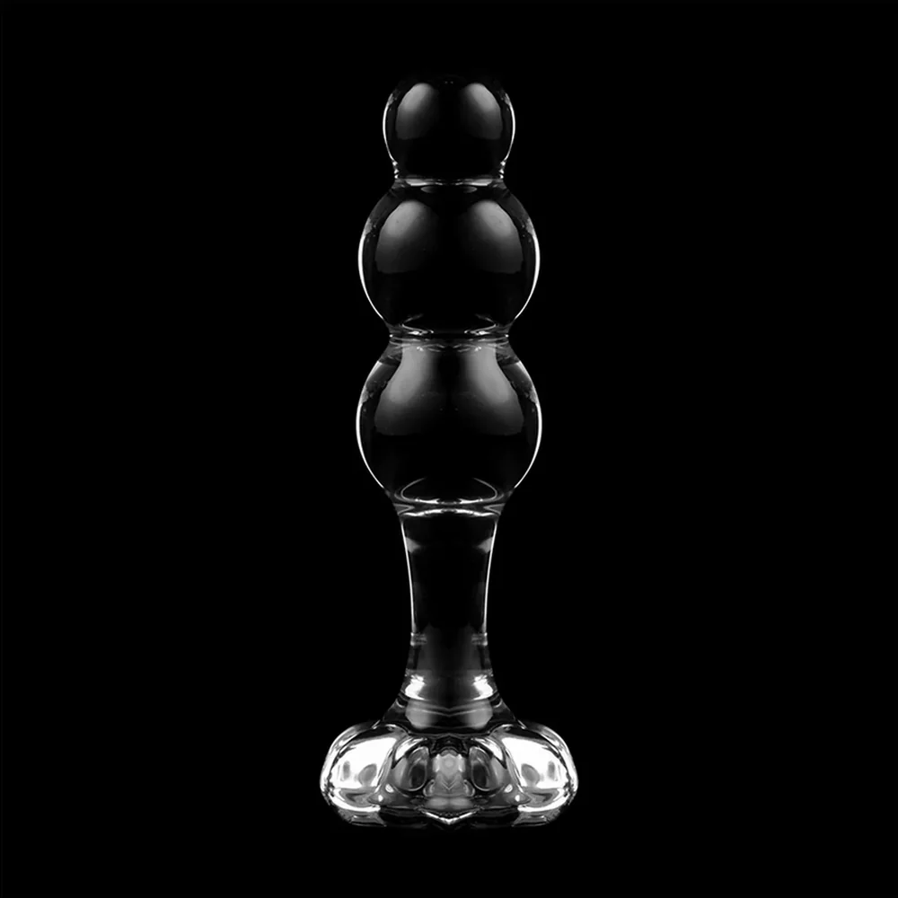Plug anal en verre borosilicate transparent avec trois sphères superposées sur une base évasée, fond blanc