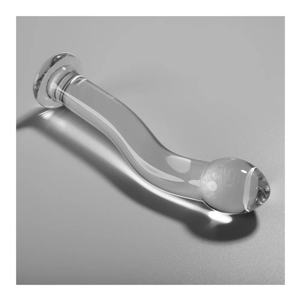 Gode en verre transparent avec embout sphérique et tige incurvée, présenté avec son emballage noir