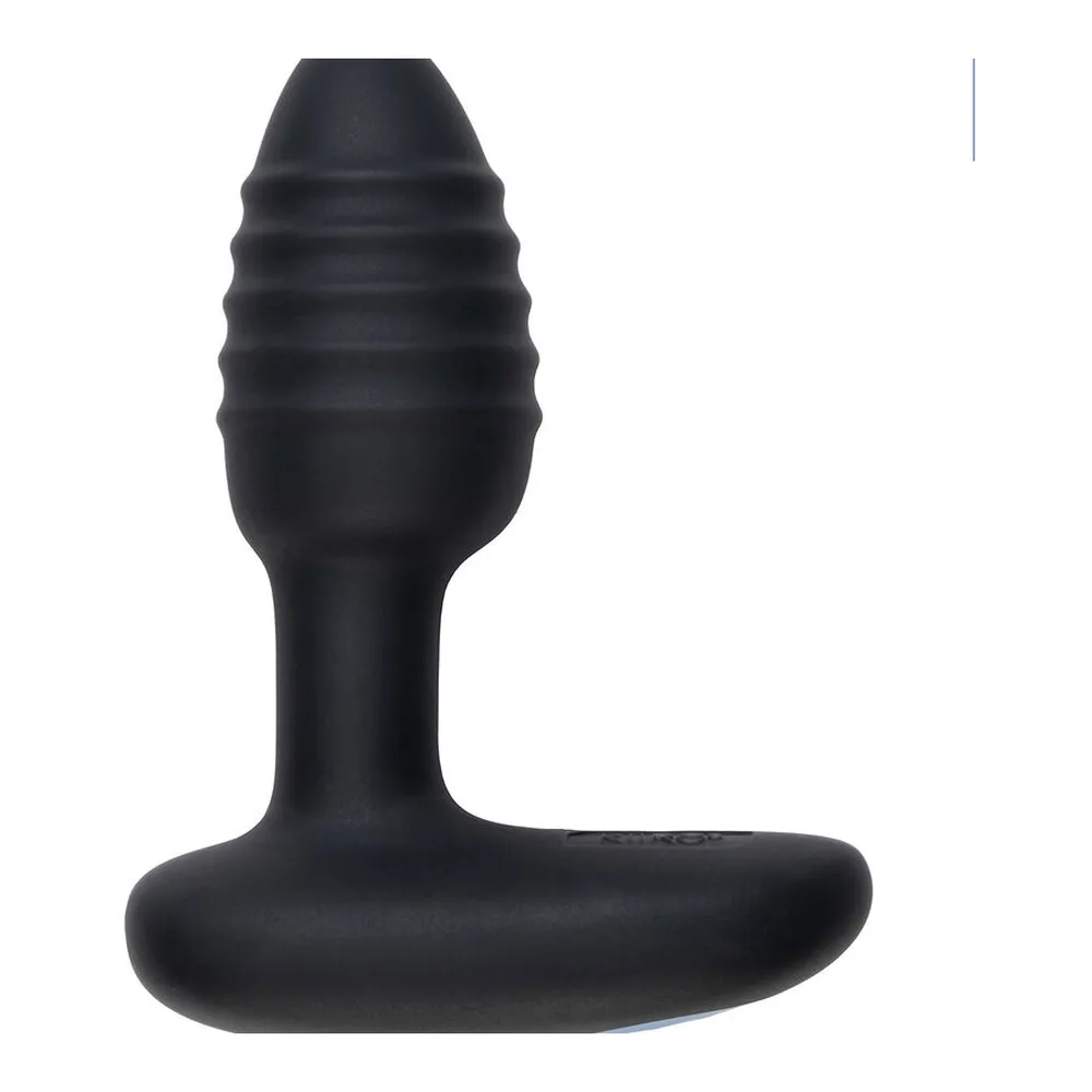 Plug anal noir rainuré avec base plate, accompagné de sa télécommande noire ovale, sur fond blanc