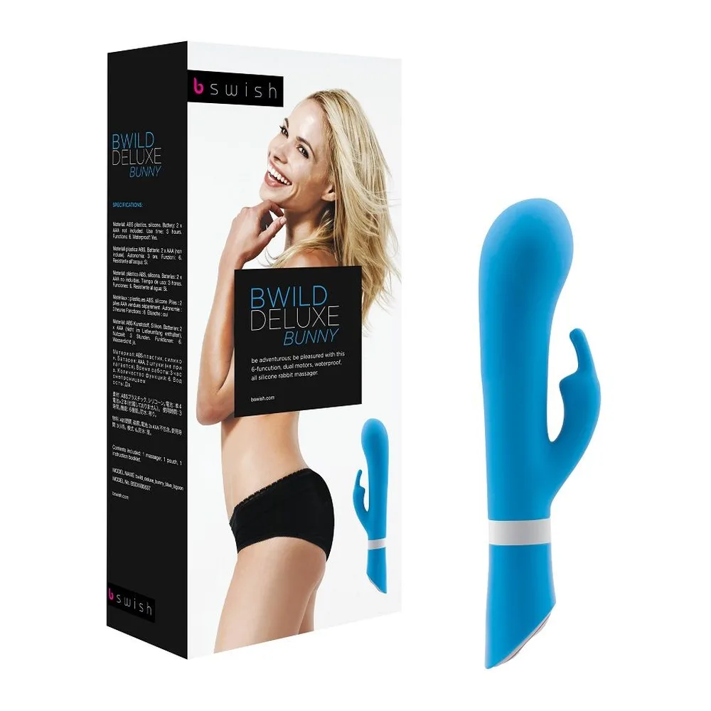 Emballage et vibromasseur rabbit bleu turquoise Bwild Deluxe Bunny avec branche flexible et bande blanche, présenté à côté de sa boîte noire montrant une femme souriante