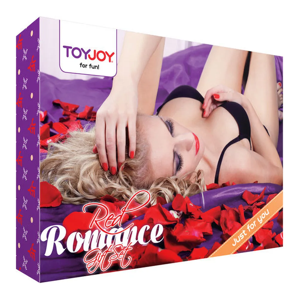 Vibromasseur rouge brillant de forme allongée avec embout arrondi et bague métallique argentée près de la base, sur fond blanc