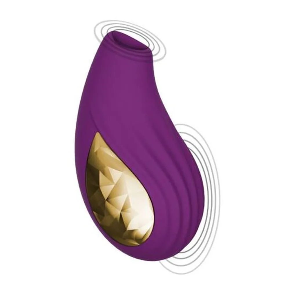 Stimulateur clitoridien Divine en silicone violet avec détail doré, forme de goutte arrondie, sur fond blanc