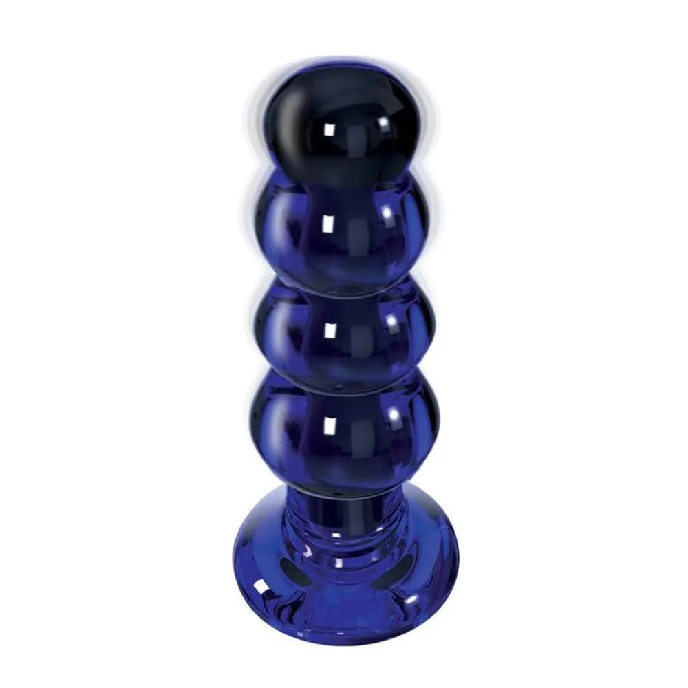 Plug en verre bleu cobalt et noir brillant, à structure graduée de perles rondes empilées sur une base plate, sur fond blanc