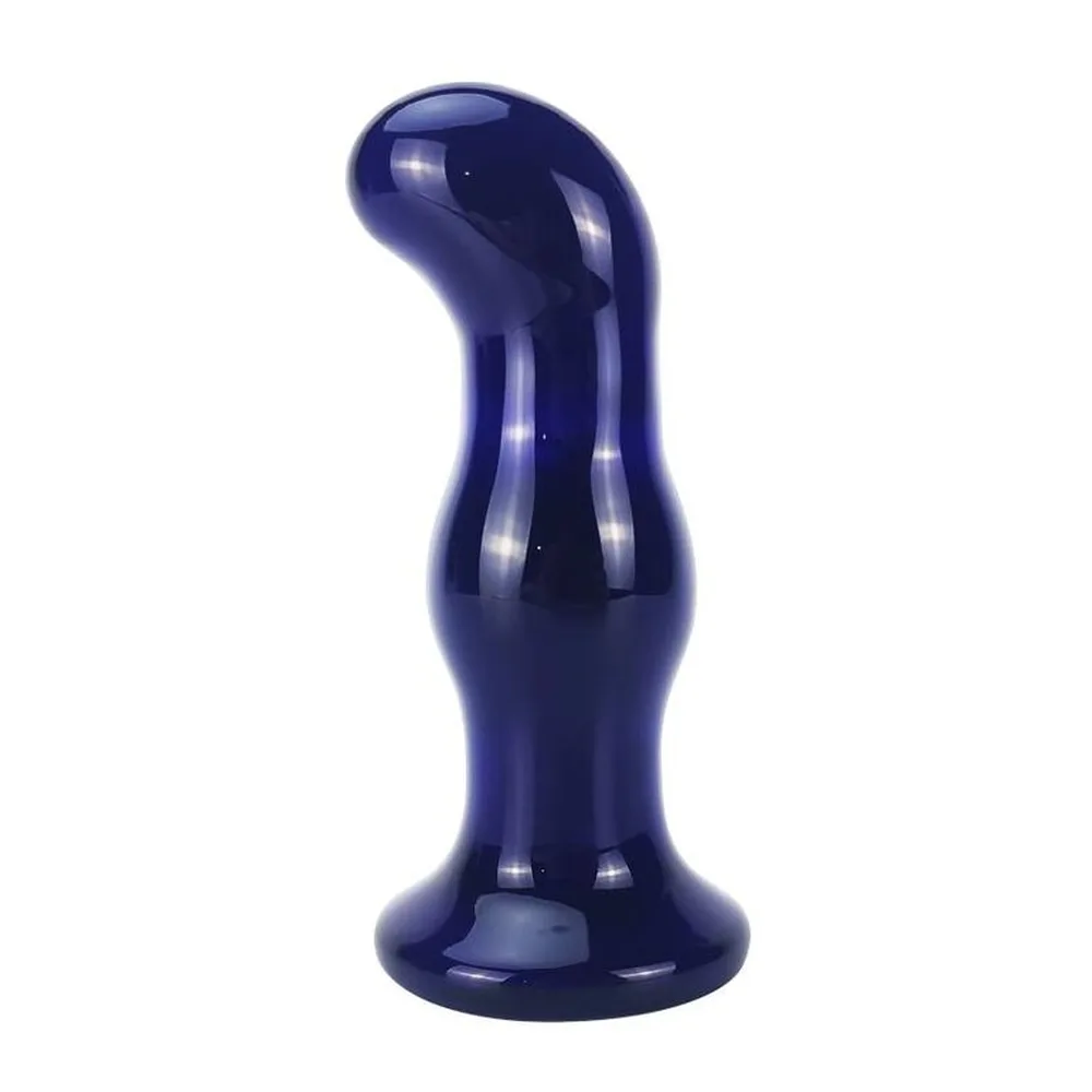 Vibromasseur en verre bleu foncé brillant, forme tubulaire avec deux renflements arrondis, base plate et large, orifice à l'extrémité supérieure, fond blanc