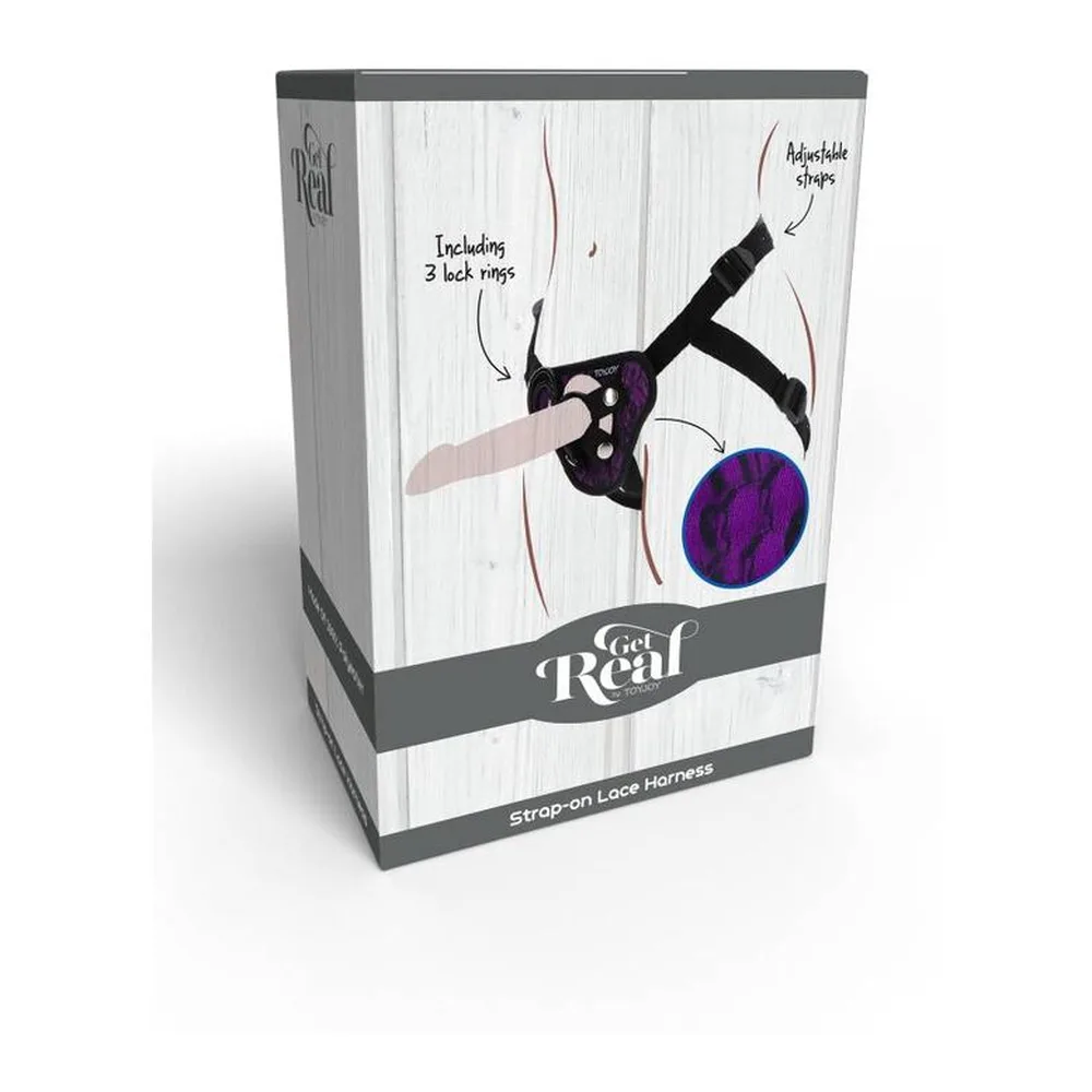 Harnais strap-on noir avec dentelle violette et bleue, ceinture ajustable avec bretelles, incluant 3 anneaux de fixation, illustré en schéma technique avec détail du motif de la dentelle