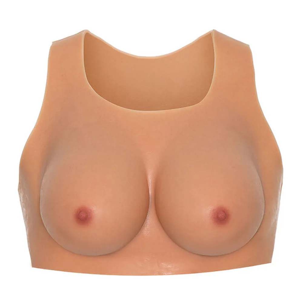 Haut en silicone couleur chair avec poitrine intégrée en relief, encolure ronde, sans manches, vue de face sur fond blanc