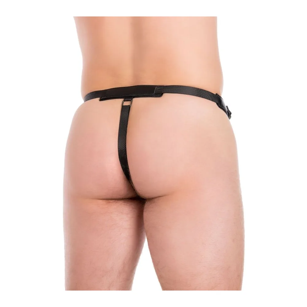 Emballage du manchon pénis Inferno en silicone, montrant le produit beige chair à travers une fenêtre transparente, avec harnais à sangles noires attaché