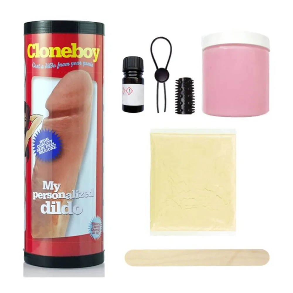 Kit de moulage comprenant un pot rose avec couvercle blanc, une baguette de bois, une feuille de poudre beige, une brosse noire, un élastique noir et un petit flacon blanc