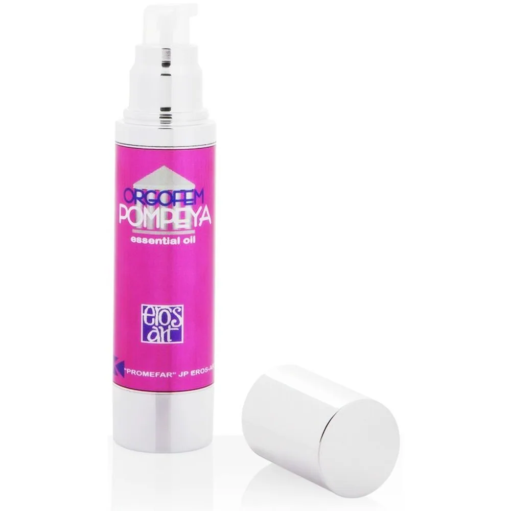 Flacon vaporisateur rose fuchsia de Pompeya essential oil avec bouchon blanc et capot cylindrique blanc posé à côté, étiquette visible avec logo