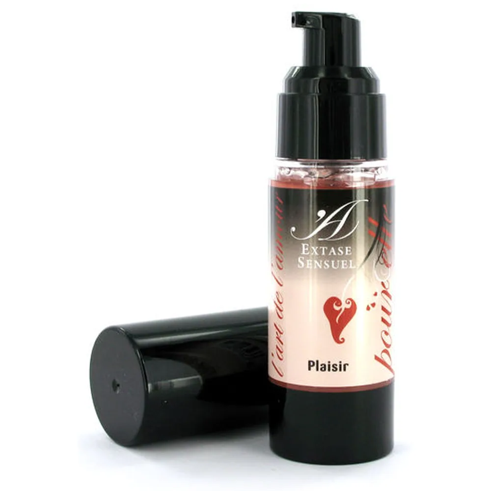 Flacon pompe airless noir avec étiquette dégradée beige et rouge, « Extase Sensuel » et « Plaisir » visibles, capuchon noir à proximité sur fond blanc