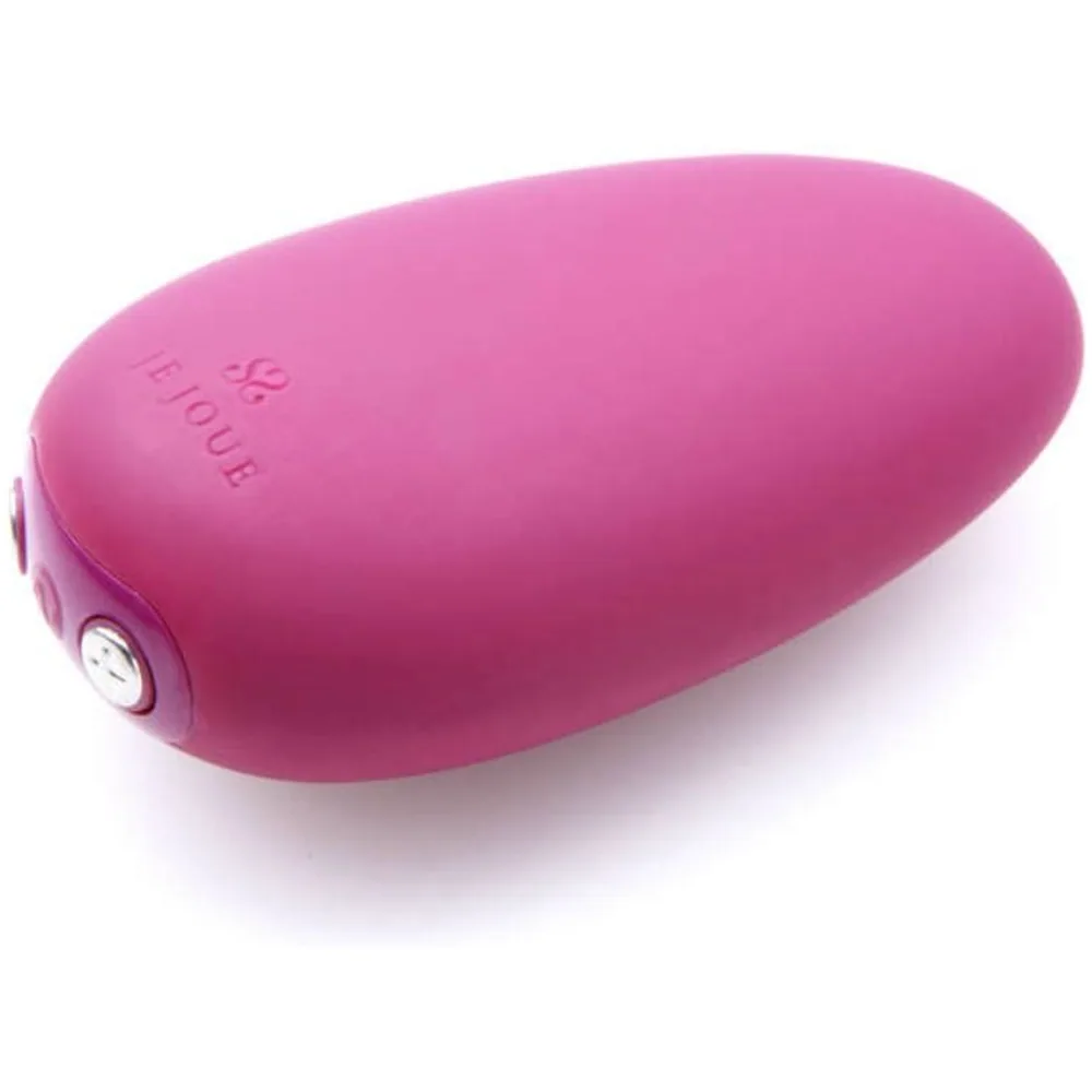 Stimulateur clitoridien Mimi Soft de forme oblongue en silicone rose satiné, avec bouton de commande latéral visible sur fond blanc