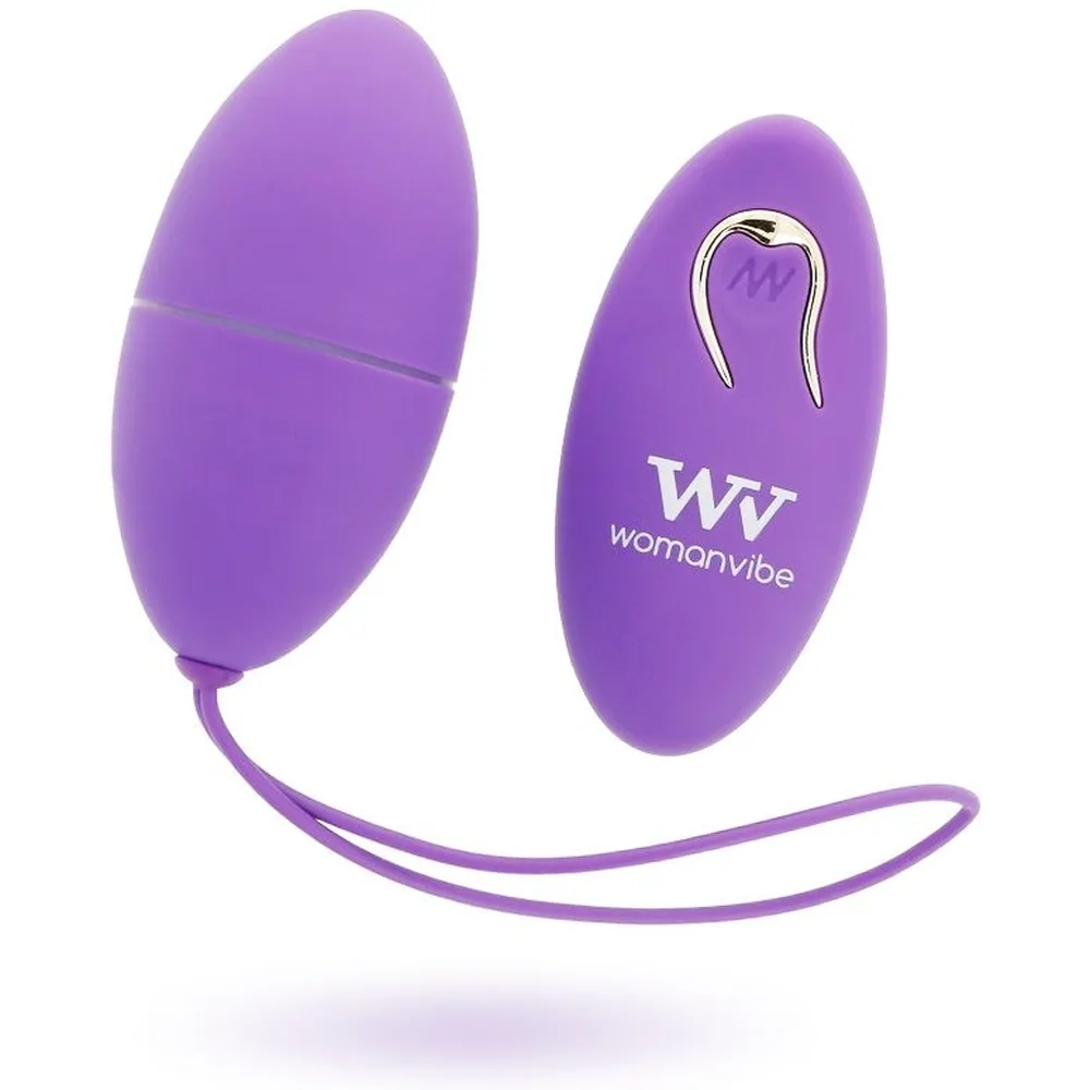 Œuf vibrant en silicone violet avec télécommande assortie, reliés par un cordon, sur fond blanc