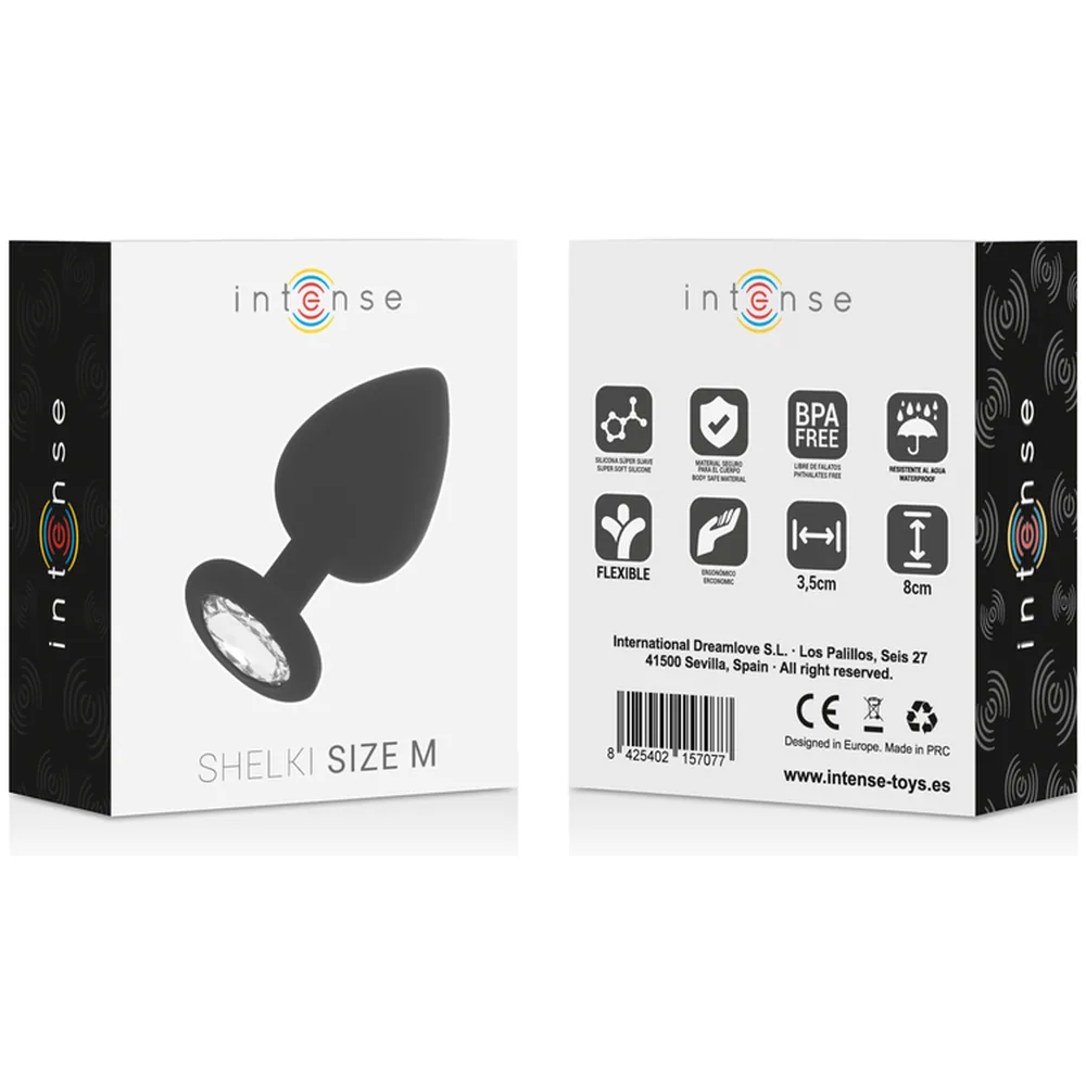 Plug anal en silicone noir avec base évasée, orné d'un cristal transparent facetté sur l'extrémité arrondie, fond blanc