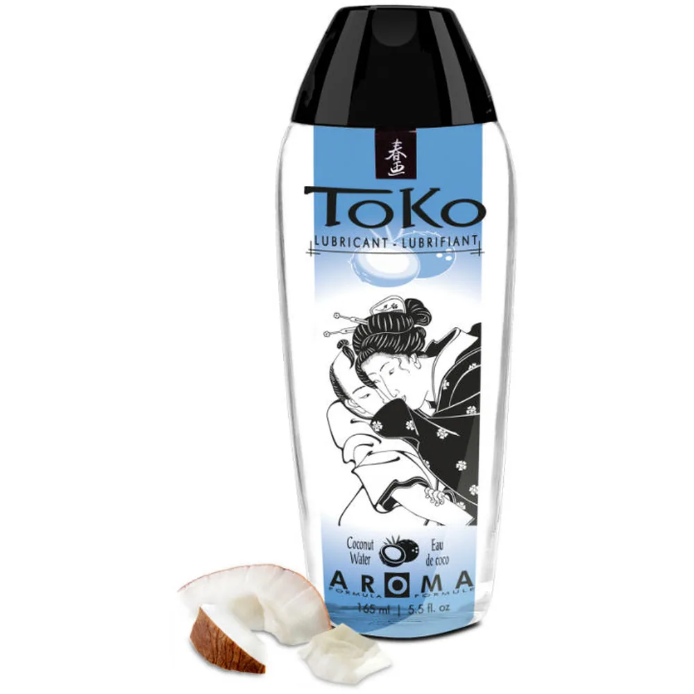 Flacon de lubrifiant Toko Aroma à base eau, blanc et bleu, de 165 ml, aromatisé noix de coco avec illustration japonaise, entouré de morceaux de noix de coco frais