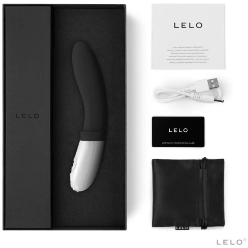 Stimulateur de prostate noir et blanc, forme ergonomique avec commandes tactiles sur le manche blanc, fond gris neutre