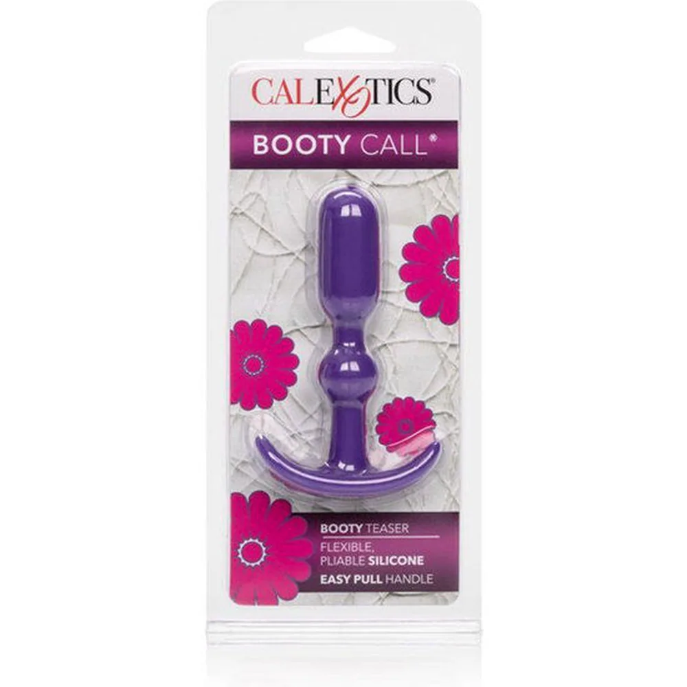Plug anal en silicone violet avec tête arrondie, collet bombé au centre et base évasée en forme d'ancre, sur fond blanc