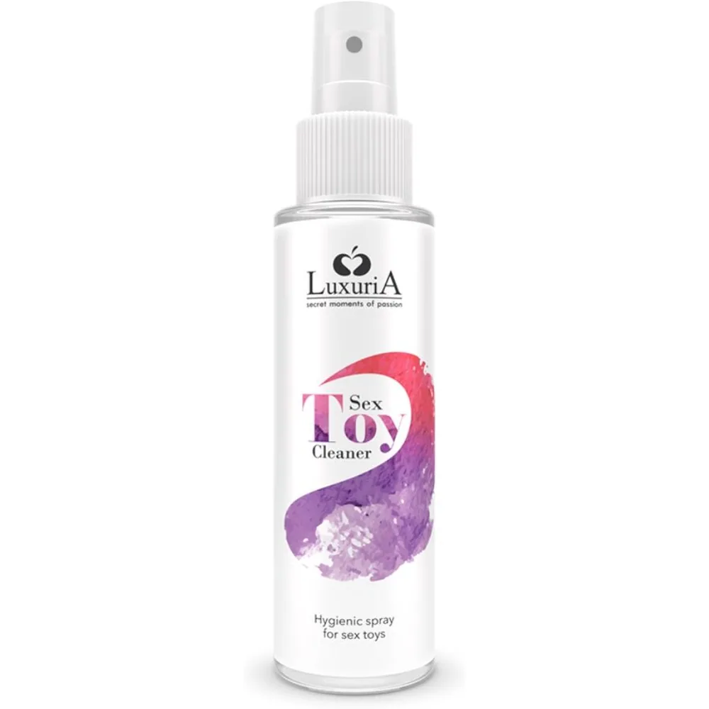 Spray nettoyant Luxuria blanc avec bouchon vaporisateur, étiquette rose et mauve indiquant « Sex Toy Cleaner » et « Hygienic spray for sex toys »