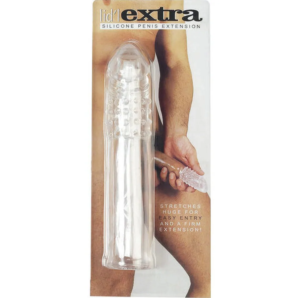 Extension de pénis en silicone transparent, à tête élargie texturée de picots et corps lisse cylindrique sur fond blanc
