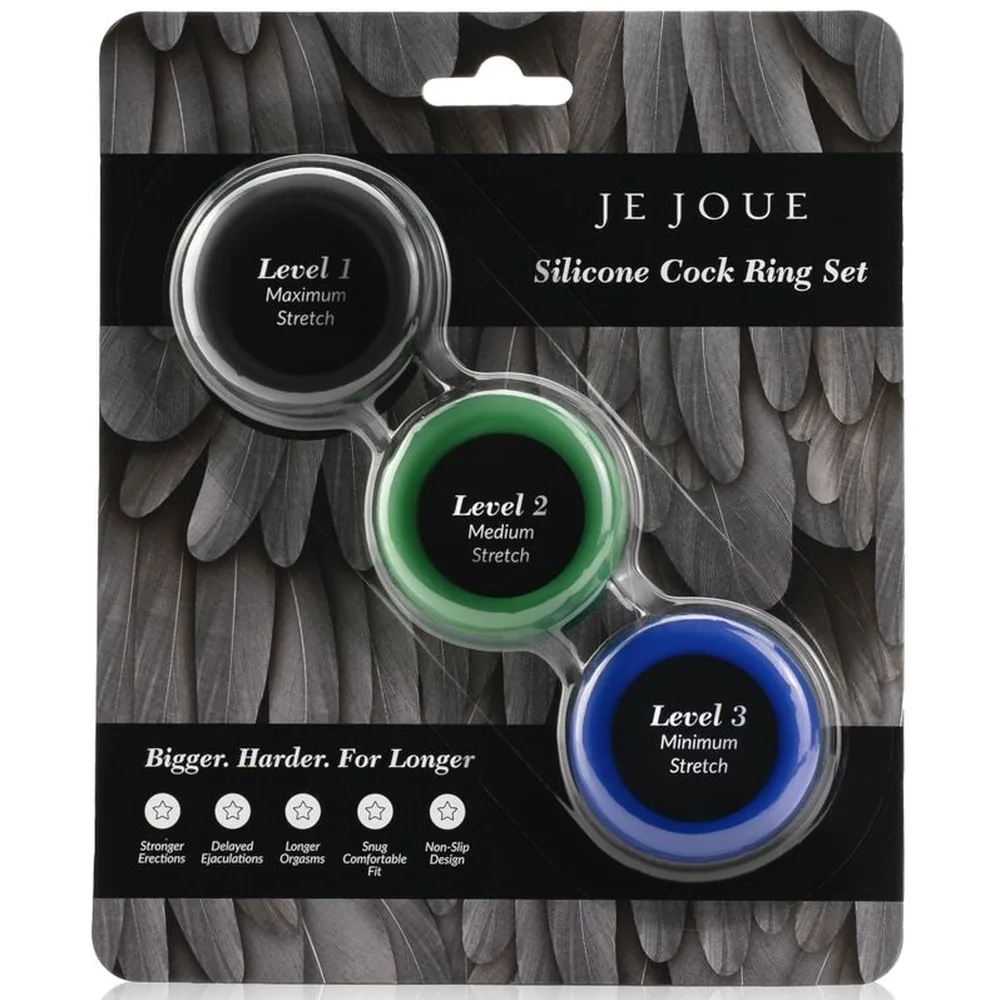 Trois anneaux en silicone de diamètre identique, coloris noir, vert et bleu, disposés côte à côte sur fond blanc