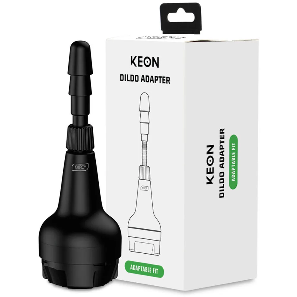 Adaptateur de gode noir Keon avec embout étagé sur fond blanc, présenté avec son emballage de vente montrant schéma et caractéristiques