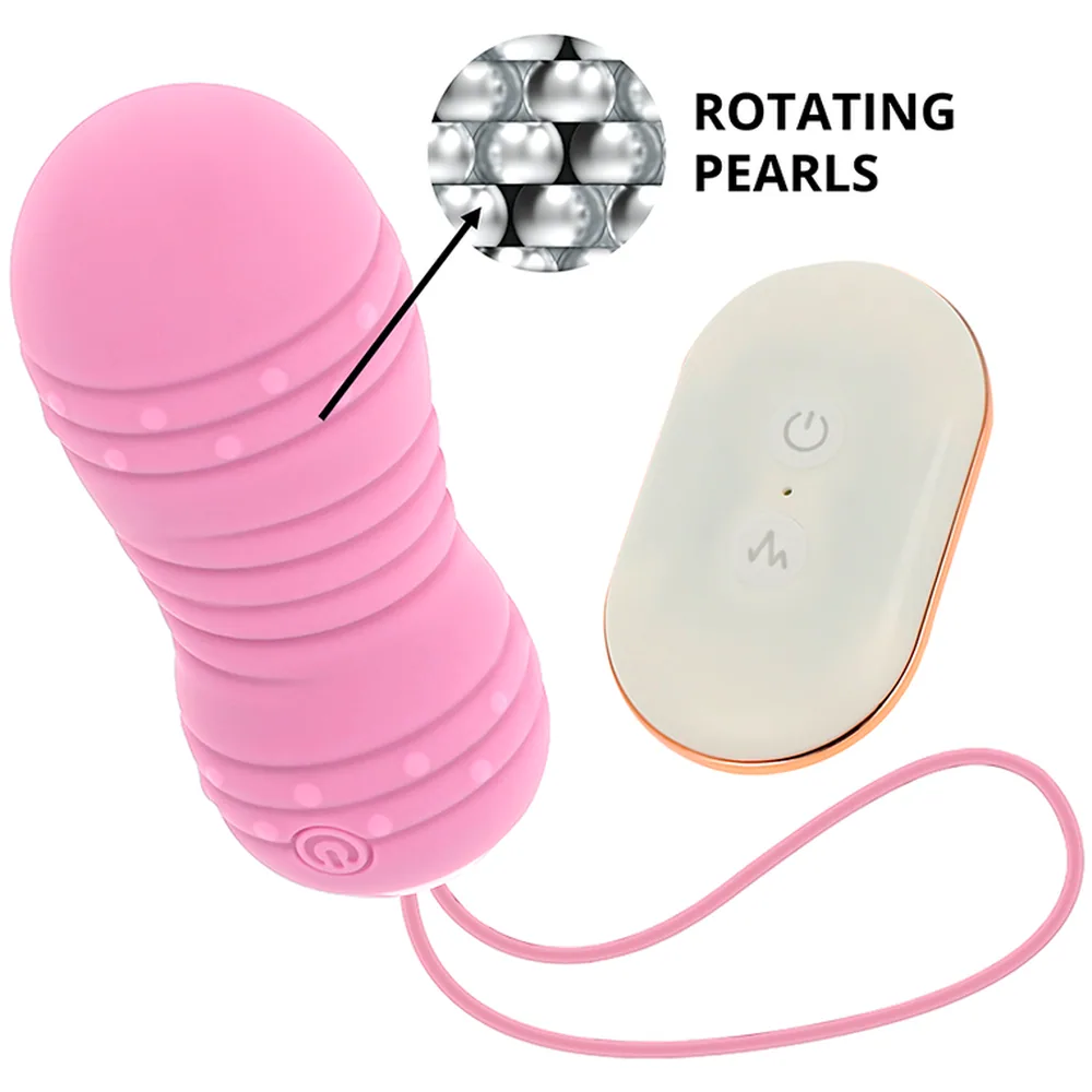 Œuf rose pâle à rainures avec perles internes, connecté par cordon rose à une télécommande blanche et beige affichant bouton marche et symboles de contrôle