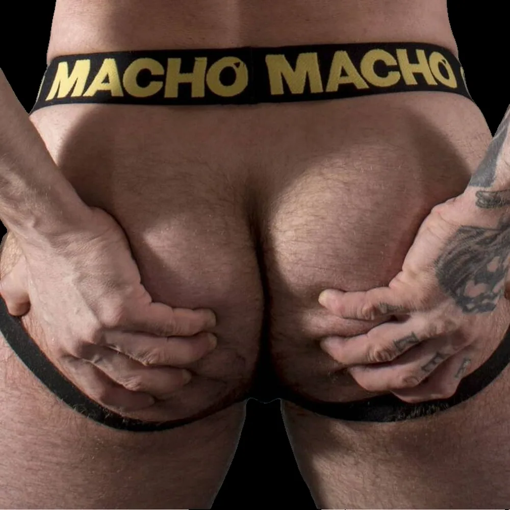 Jock similicuir noir avec coque avant bombée, bandes élastiques jaunes à lettrage « MACHO », porté de face sur peau
