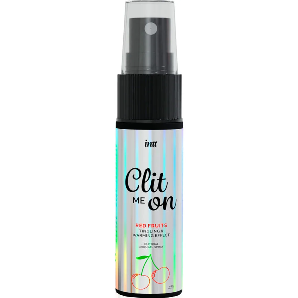 Spray Clit me on aux fruits rouges avec flacon transparent et noir, bague pulvérisatrice, sur emballage multicolore à rayures avec illustration de cerises