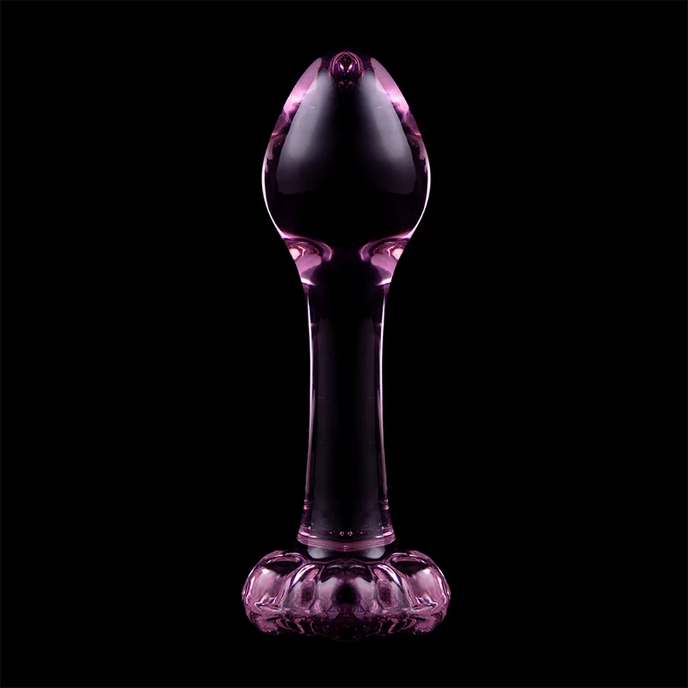 Plug anal en verre transparent avec base évasée, boule lisse au sommet et tige centrale, sur fond blanc