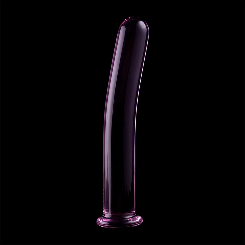 Emballage et produit : boîte noire et violette avec gode en verre borosilicate rose transparent, forme cylindrique allongée avec base évasée arrondie, parois lisses et brillantes