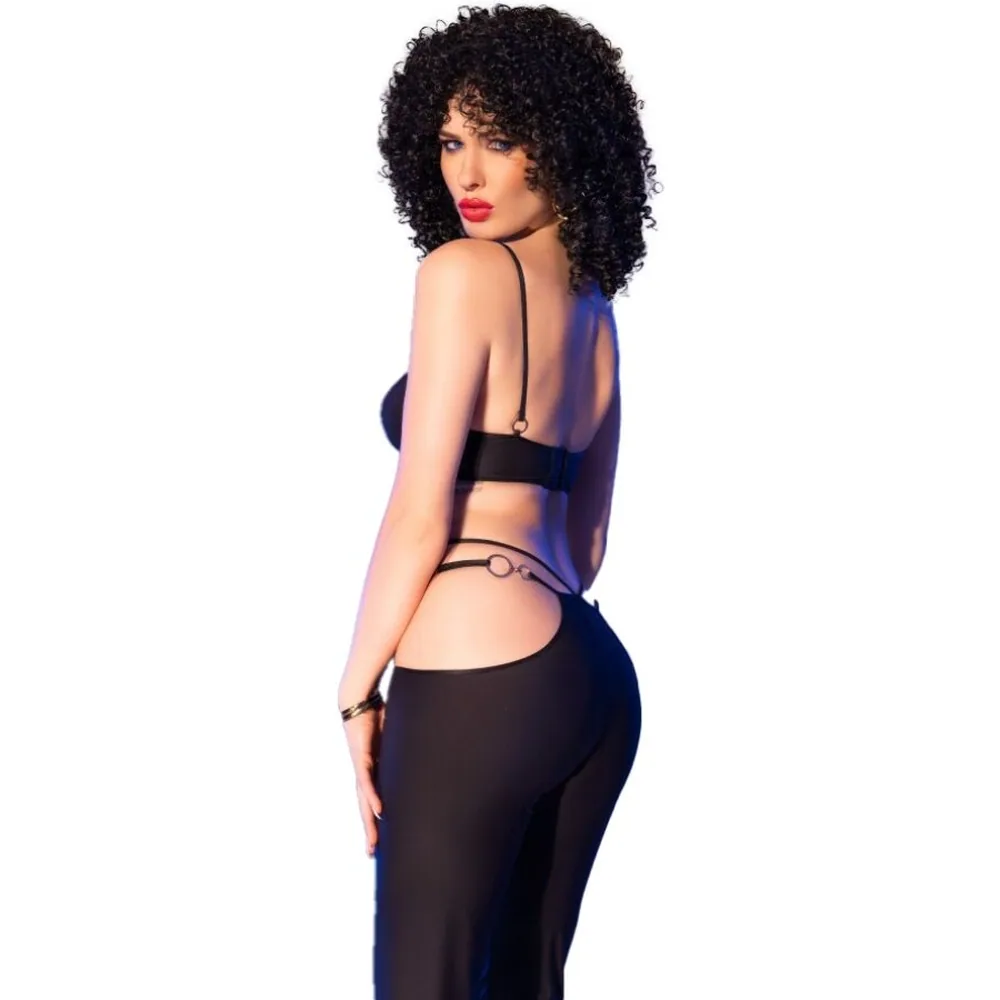 Ensemble deux pièces noir composé d'un haut cache-cœur avec anneau doré et d'un pantalon fluide transparent, porté de profil sur fond blanc