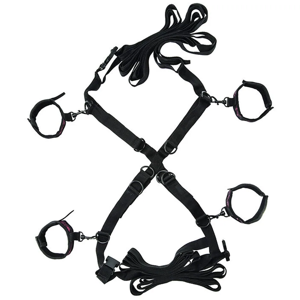 Croix de sangles noires avec menottes aux quatre extrémités et cordes d'attache, vue de face sur fond blanc
