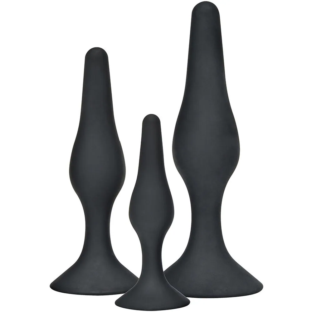 Schéma de dimensions montrant trois plugs anaux en silicone noir incurvé, de petite à grande taille, avec indication des diamètres et longueurs en centimètres