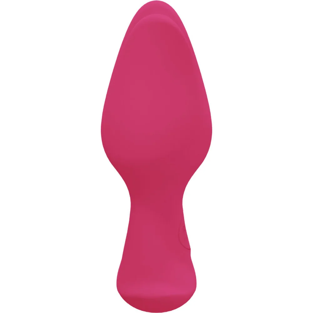 Plug anal en silicone rose foncé avec base asymétrique et ailettes, sur fond blanc