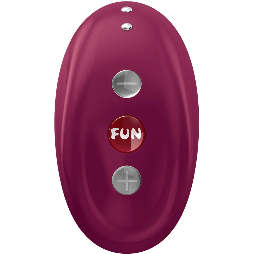Vibromasseur ergonomique de forme arrondie en silicone prune, trois boutons de commande sur le dessus dont un marqué « FUN », ouverture moulée visible à la base