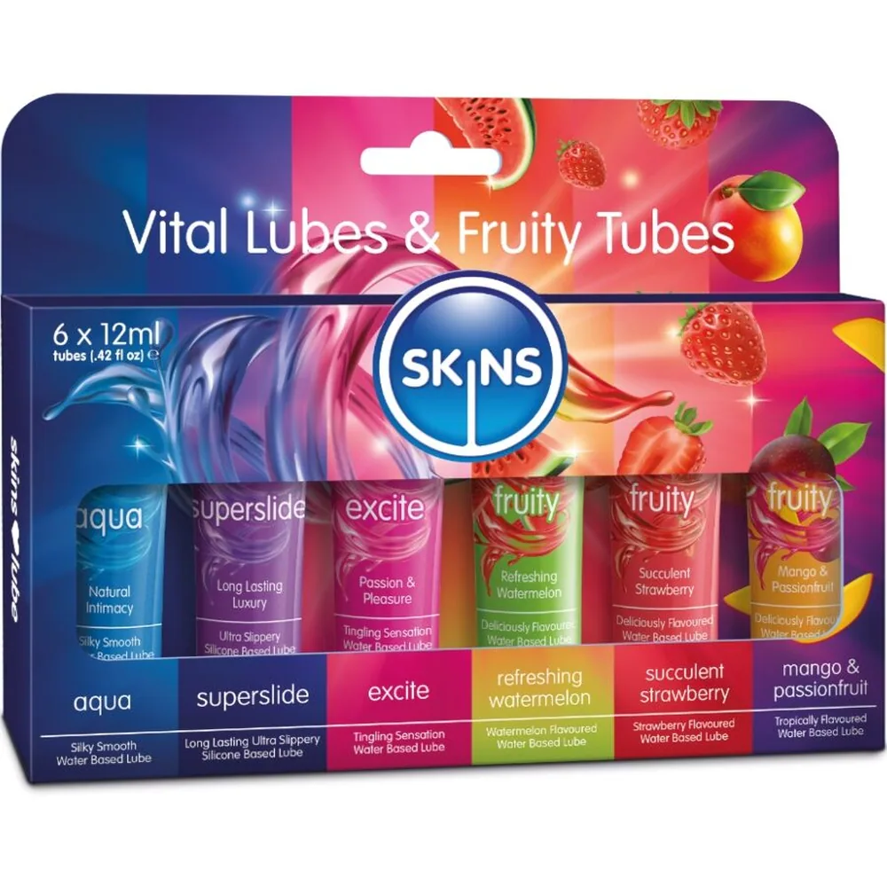 Six tubes de lubrifiant Skins de différentes couleurs alignés : rose excite, bleu aqua, violet superslide, orange fruity, vert fruity et rouge fruity, chacun étiqueté avec ses caractéristiques