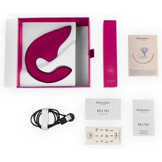 Contenu de la boîte du Womanizer Blend fuchsia, câble magnétique et notices