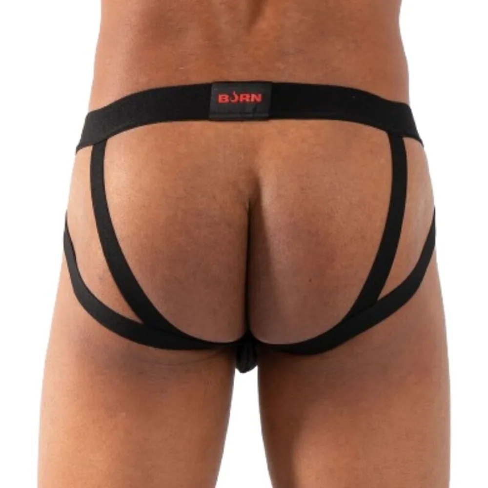 Jockstrap noir porté, avec deux sangles latérales par côté, taille basse, sur fond blanc